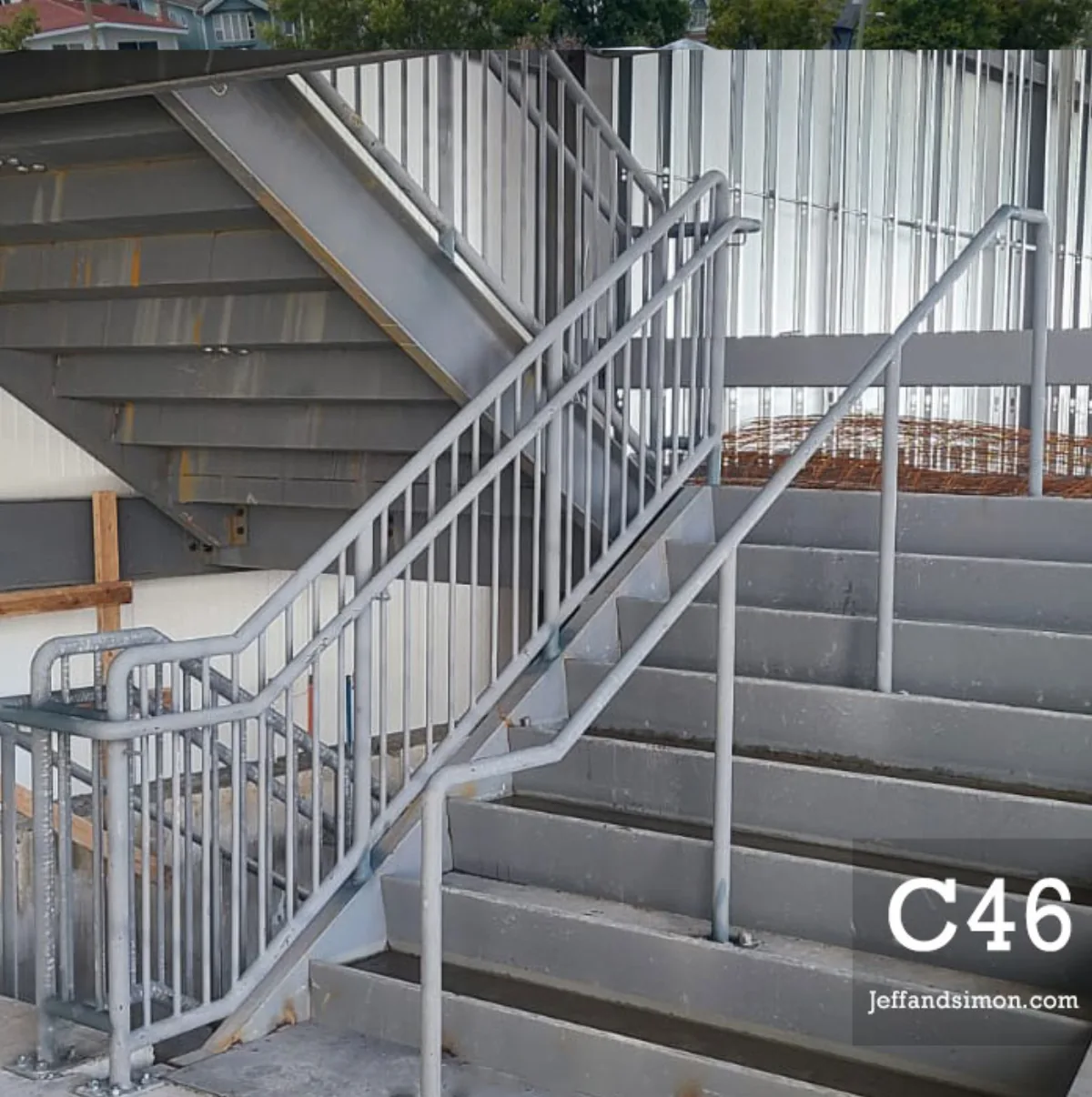 Commercial metal stair with steel guard and clean black finish