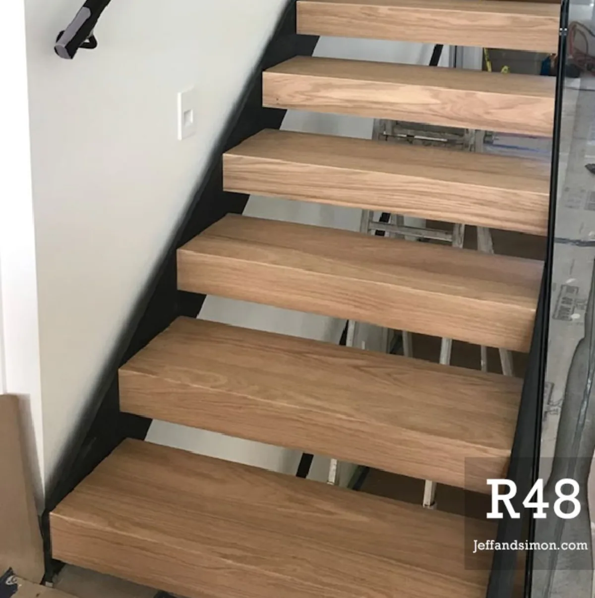 Custom mono stringer staircase with oak treads and glass railing — Vancouver Stairs residential project