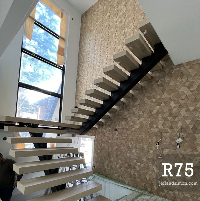 Residential metal staircase with open risers and clean black steel details